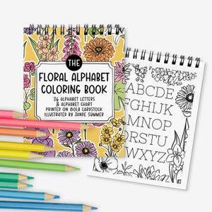 May include: A floral alphabet coloring book with a yellow floral cover and a spiral binding. The cover features the text "The Floral Alphabet Coloring Book" and includes colored pencils in various colors. The book includes 26 alphabet letters and an alphabet chart.