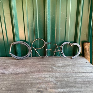 Handcrafted Metal &#39;DREAM&#39; Art Sculpture: Recycled Scrap Metal Decor