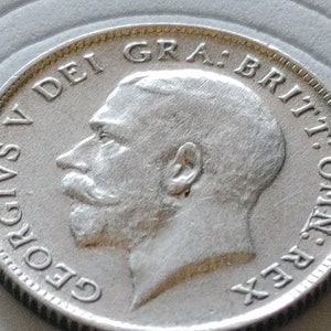 1921 United Kingdom silver sixpence about uncirculated superb details with new holder included.