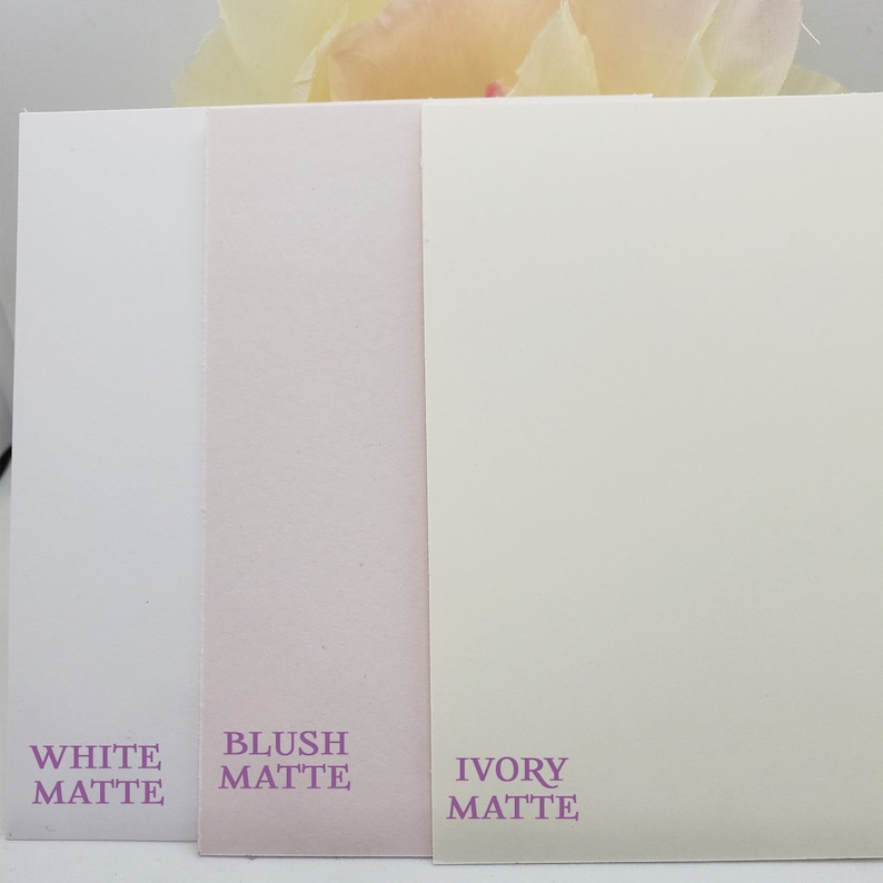 May include: Three cardstock samples in white, blush, and ivory matte finishes. The text on the cards reads "White Matte", "Blush Matte", and "Ivory Matte".