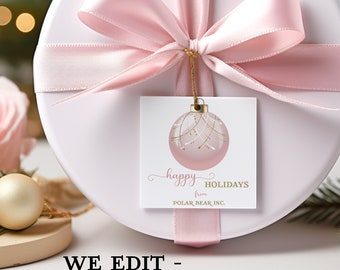 May include: A pink and gold Christmas gift tag with a pink ornament and the text "happy holidays from POLAR BEAR INC."