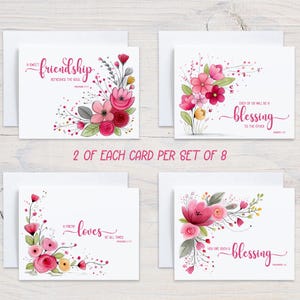 May include: Set of eight greeting cards with floral designs and inspirational quotes. Each card features watercolor flowers in shades of pink and red, with accompanying white envelopes. The cards include phrases like "friendship refreshes the soul" and "you are such a blessing."