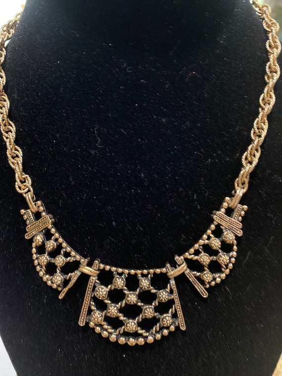 Vintage dark gold colored metal necklace with brac