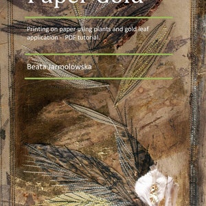 May include: A close-up of a book cover with the title "Paper Gold" printed in gold lettering. The cover features a textured background with gold leaf and a floral design.