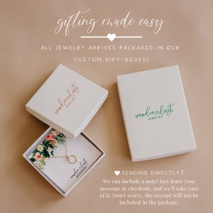 May include: Two white gift boxes with the logo "wanderlust jewelry" printed on them. The boxes are open and show a necklace with a circle pendant inside one of the boxes. The text "SENDING DIRECTLY? We can include a note! Just leave your message at checkout, and we'll take care of it. Don't worry, the receipt will not be included in the package." is printed below the boxes.