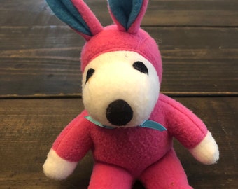 Vintage Snoopy dressed as Easter Bunny with pink suit.