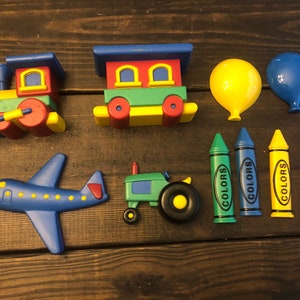 Vintage Hard Plastic Childrens Wall Decor. Trains, Tractor, Plane, Crayons etc