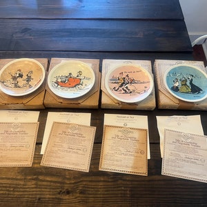 May include: Set of four decorative plates with colorful illustrations of people in vintage cars and winter scenes. Each plate comes with a certificate of ownership and negotiable transfer.