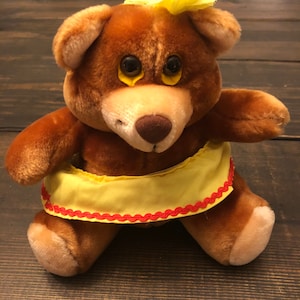 Vintage 1987 Barnum and Bailey Ringling brothers Plush Teddy Bear with yellow skirt and yellow flower