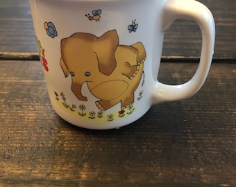 Vintage Melody Mug 1980’s or 1970’s Sunny Funnies Dancing Elephant with flowers and Butterflies.