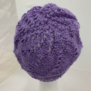 Hand knit cap with brim.