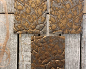 luxurious bronze gold coasters, handmade ceramic, set of 3, square, carved, flower design, luxury, metallic, home wares, Glazed Stoneware