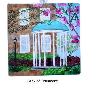 University of North Carolina Old Well Christmas ornament with lightweight acrylic design and satin ribbon for hanging.