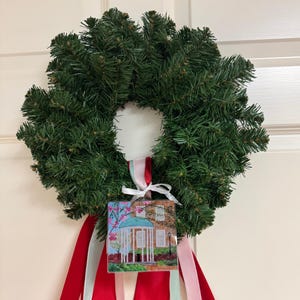 Carolina blue UNC acrylic ornament designed from original Old Well artwork for elegant college holiday decor.  You can hang this ornament on a tree or wreath.