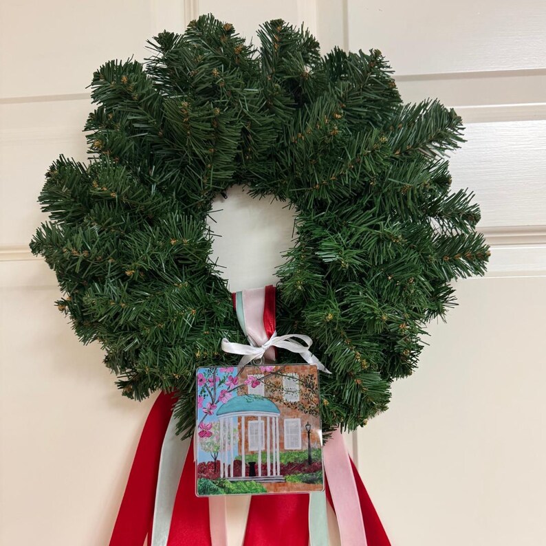 Carolina blue UNC acrylic ornament designed from original Old Well artwork for elegant college holiday decor.  You can hang this ornament on a tree or wreath.