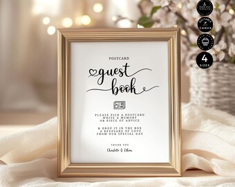 May include: A framed guest book sign with gold trim. The sign reads "guest book" in elegant script, with instructions to write a memory or advice on a postcard. Includes the names Charlotte & Ethan.
