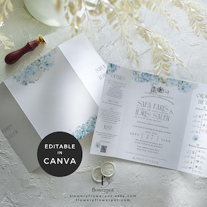 May include: A trifold wedding invitation with a light blue floral design. The invitation features the names "SAFA FARIS & IDRIS SALEH" and the date "SEPT 27 20XX". The text "EDITABLE IN CANVA" is also displayed on the invitation.