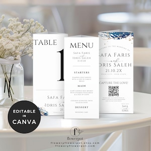 May include: A set of three printable wedding table cards with a blue and gold watercolor design. The cards include a table number, a menu, and a welcome card with a QR code. The text on the cards reads "Table 1", "Menu", "Safa Faris and Idris Saleh 21.10.2X", "Capture the Love!" and "Welcome to the Wedding of Safa Faris and Idris Saleh 21.10.2X".
