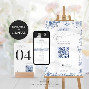 May include: Wedding signage set with a white and blue floral design. Includes a welcome sign on an easel, a table number card, and a smartphone displaying a wedding invitation. The text "EDITABLE IN CANVA" is in a black circle.