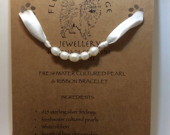 Freshwater cultultured pearl with 925 sterling silver spacers and ribbon