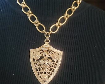 Vintage 1960's Bergere brand statement necklace jewelry gold tone knight heraldry crest big bold costume jewelry pendant mid century
