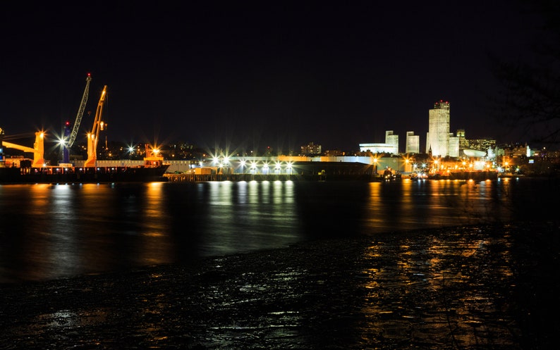 Digital Photograph on Hudson River waiting to deliver product tugboats Albany NY dockport on a night sky Barges