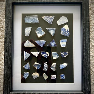 Framed blue pottery sherd collection mudlarking