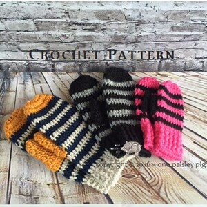 May include: A crochet pattern document featuring three pairs of handmade mittens in different color combinations: mustard yellow and navy blue, black and grey stripes, and hot pink and black stripes. The text reads CROCHET PATTERN.