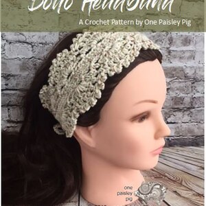 May include: A crochet headband pattern, with the title "Bollo Headband" and the text "A Crochet Pattern by One Paisley Pig". The headband is made with a beige yarn and has a delicate, lacy design.