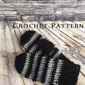 May include: A pair of crocheted mittens featuring alternating horizontal stripes of black and grey yarn. The text CROCHET PATTERN is visible at the top, and the text copyright &copy; 2016 &ndash; one paisley pig is visible at the bottom of the image.