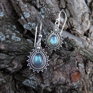 small silver earrings with drop shaped stone