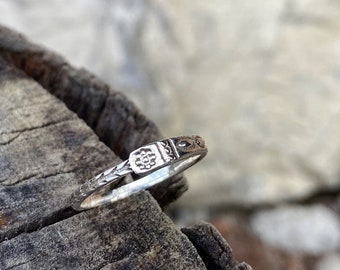 asymmetrical silver ring with detailed pattern