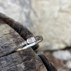 asymmetrical silver ring with detailed pattern