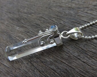 pendant with mountain crystal stone, spirals, dots and small labradorite stone silver