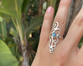 large silver ring with spirals and labradorite stone