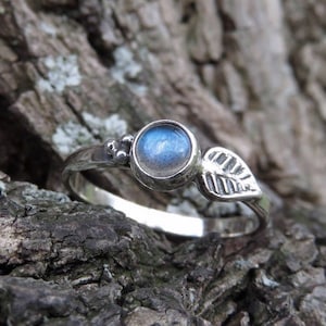 silver ring with leaf, stone and dots