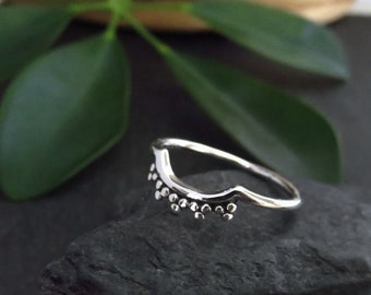 silver ring with small dots