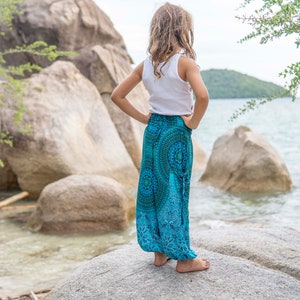 turquoise kids pants with two pockets image 4