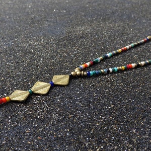 long necklace with spirals, brass and facetted glas beads bunt