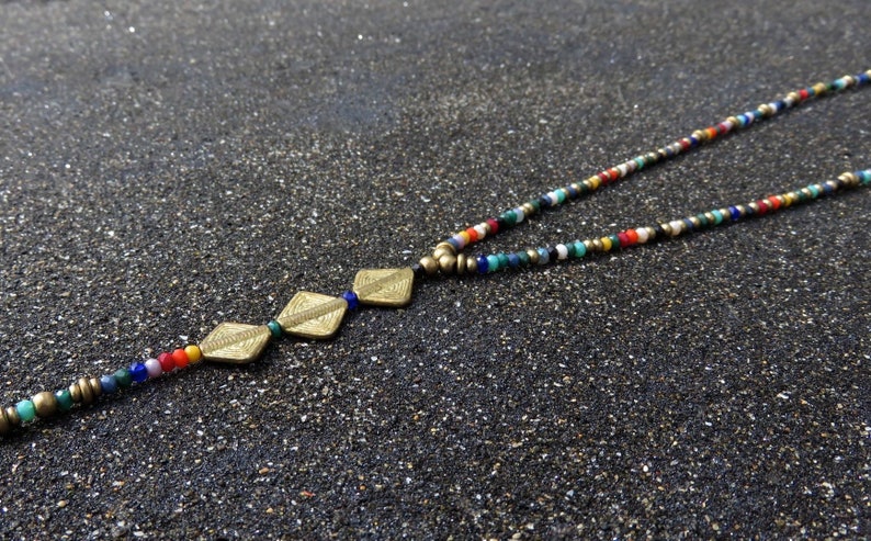 long necklace with spirals, brass and facetted glas beads bunt