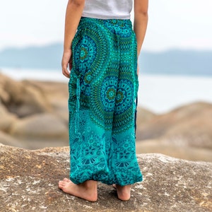 turquoise kids pants with two pockets image 8