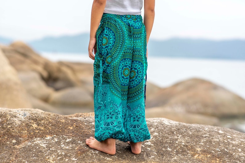 turquoise kids pants with two pockets image 8