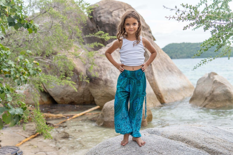 turquoise kids pants with two pockets image 9