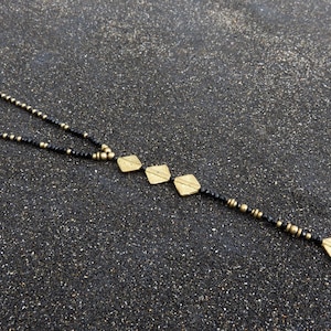 long necklace with spirals, brass and facetted glas beads schwarz