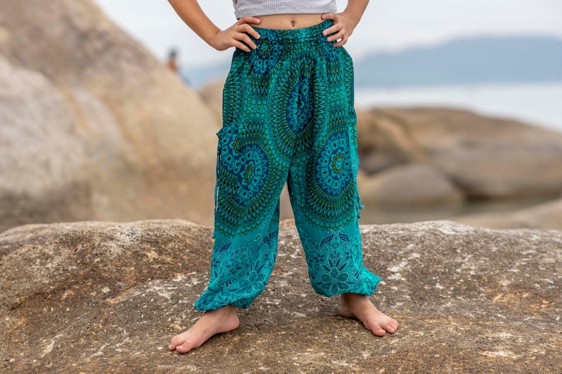 turquoise kids pants with two pockets image 6