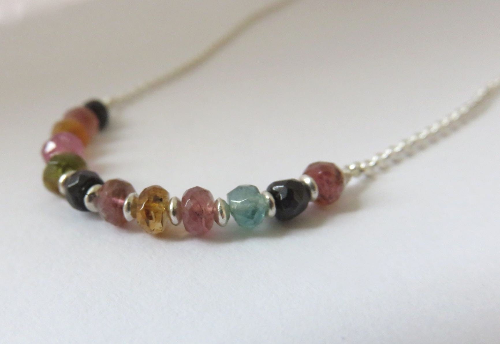 silver necklace with small tourmaline stones
