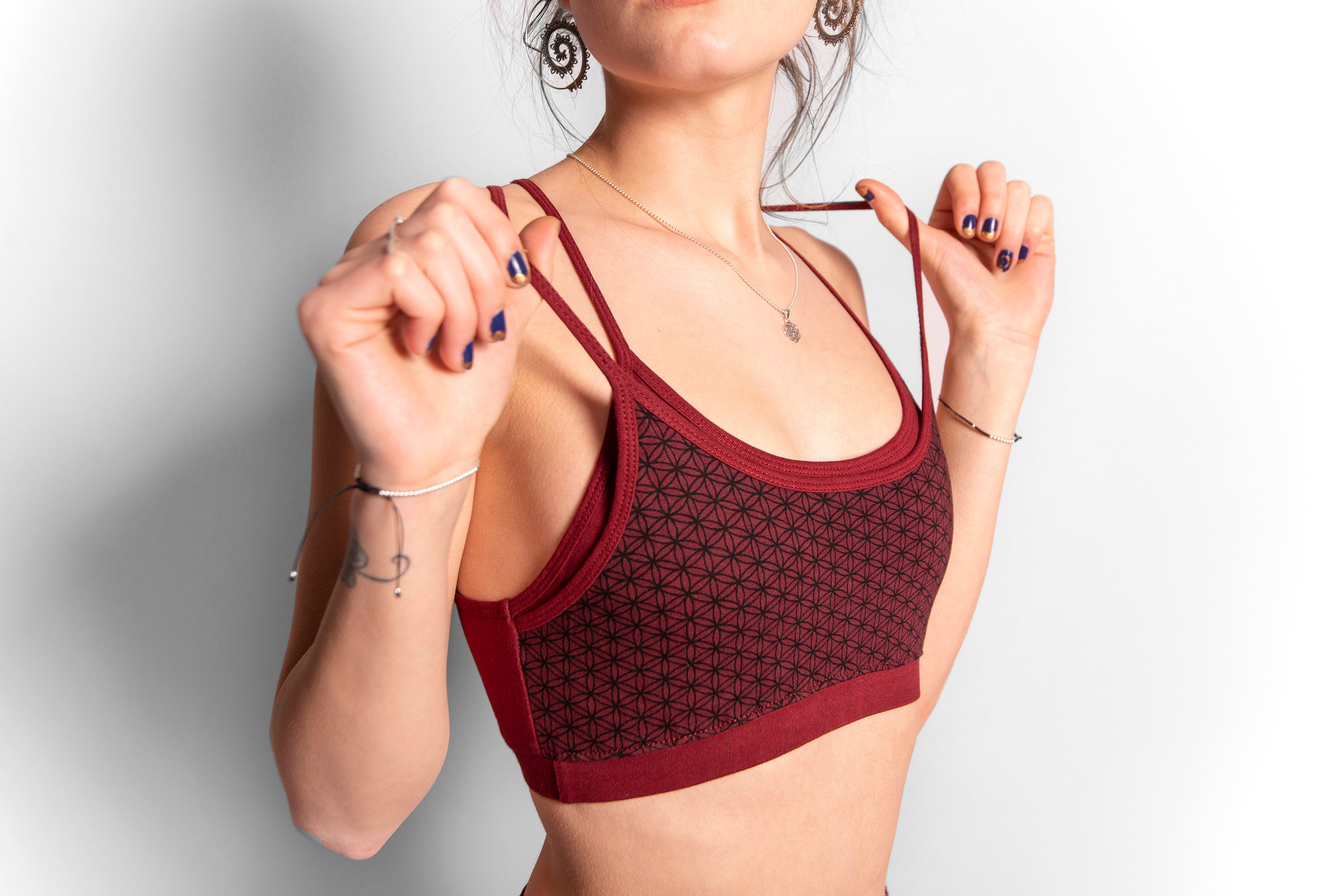 yoga top with detailed back design and flower of life print in red