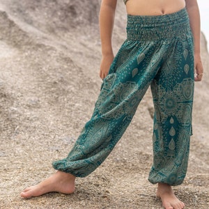 turquoise kids pants with two pockets image 4