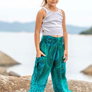 turquoise kids pants with two pockets image 7