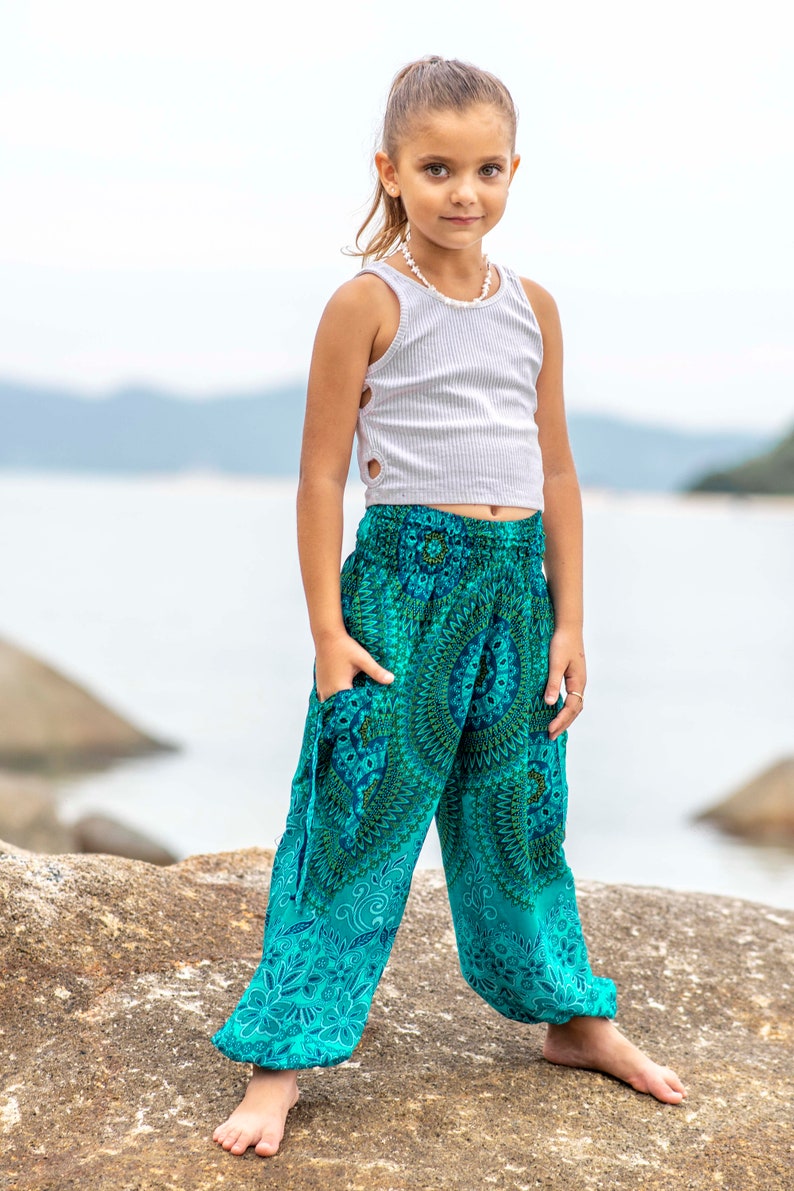 turquoise kids pants with two pockets image 7